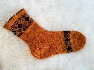 Toe-up sock with rounded toe and gusset heel.