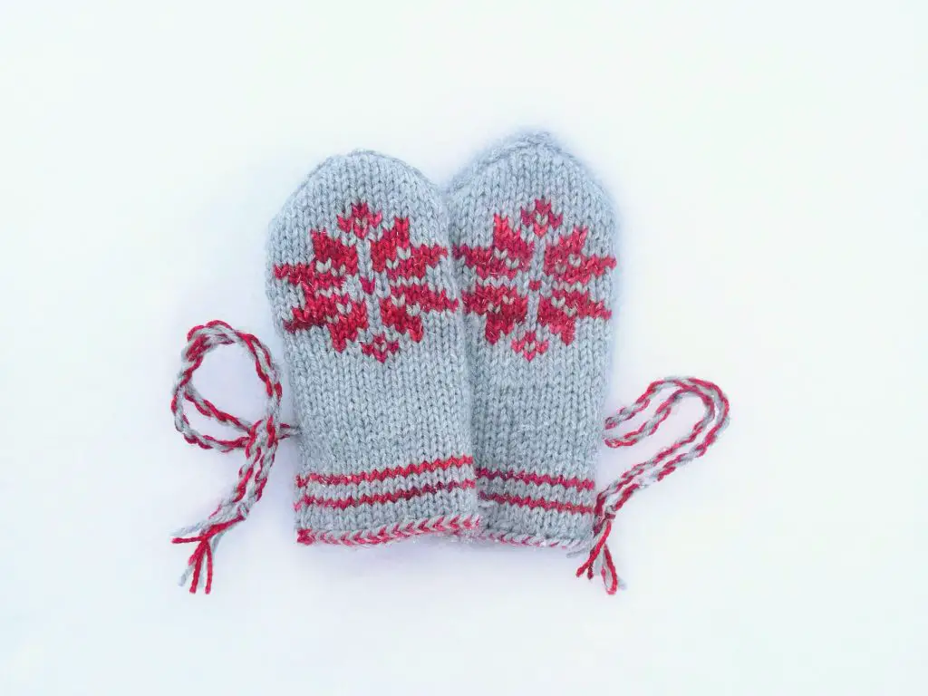 Knitted snowflake mittens for babies