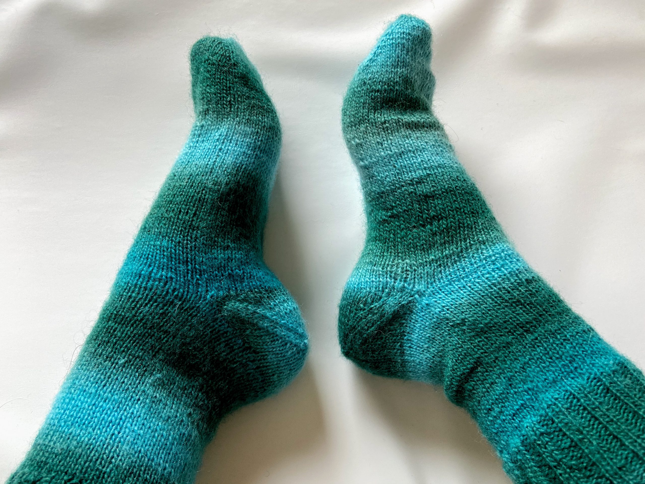 Pair of vanilla socks with afterthought heel