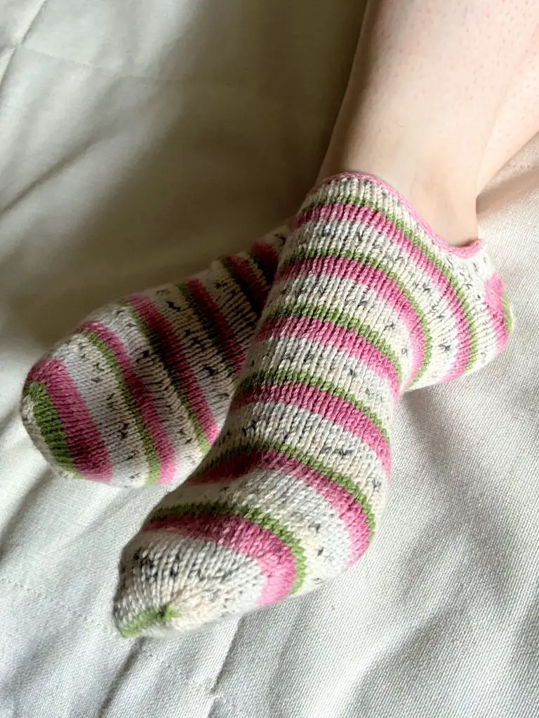 Knit ankle socks. Knitted with Regia Cotton Tutti Frutti in Colorway Dragon Fruit.